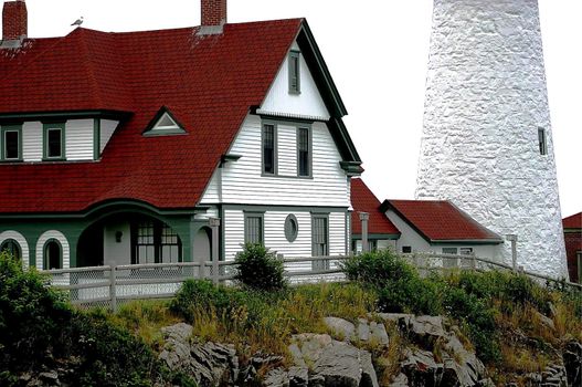 Portland Maine coastline lighthouse with a stormy cloud background