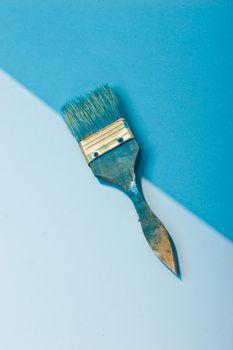blue paint brush on the blue background