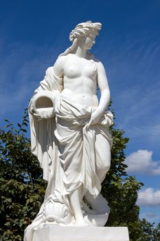 statue of Pierre Le gros (17th),in the gardens of Versailles (France), an antique woman pouring water