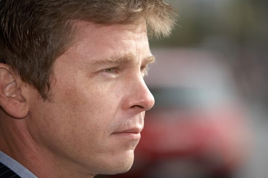 Portrait of man on city street, close-up