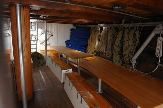  Interior of a classical vintage old wooden tall sailboat ship                              