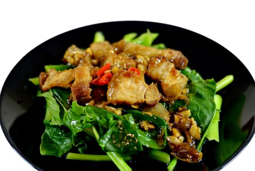 Thai stir fried chinese kale with crispy pork