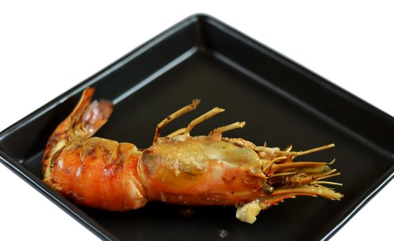 a delicious grilled prawns on black dish