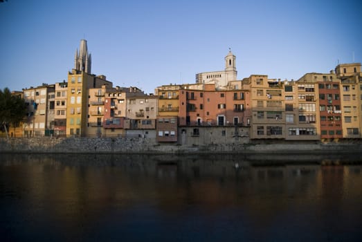 Colored buildings at the embankment in Gerona, Spain