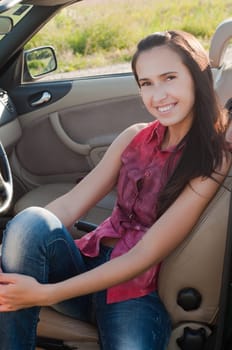 Outdoor shot of beautiful brunette woman with long hair