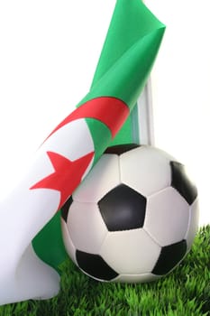 Flag of Algeria with soccer in a field