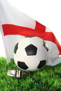 Flag of England with soccer in a field
