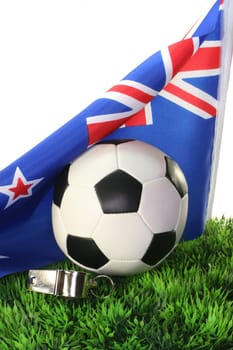 Flag of New Zealand with soccer in a field