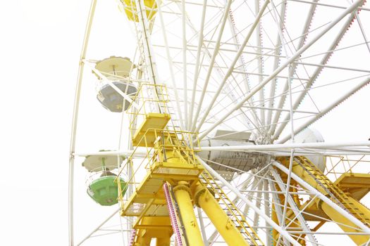 ferris wheel against a blue sky
