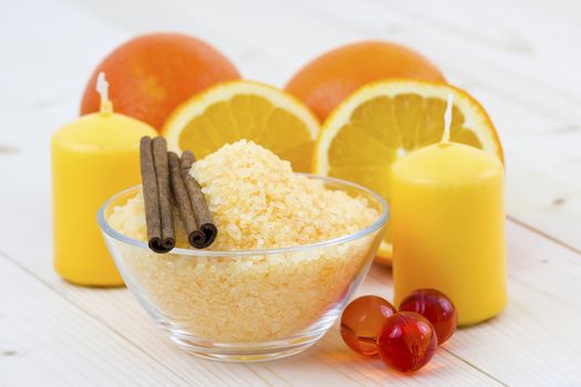 bowl of orange bath salt with fresh fruits - beauty treatment