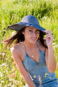 Outdoor shot of beautiful brunette woman with long hair