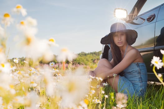 Outdoor shot of beautiful brunette woman with long hair