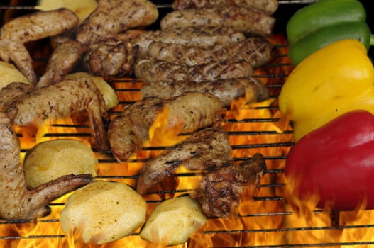 barbecue with meat and vegetable on metal grill
