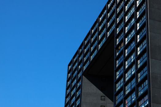 fragment of modern building over bright blue sky