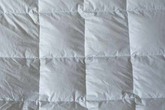 Detail of down comforter with white squares