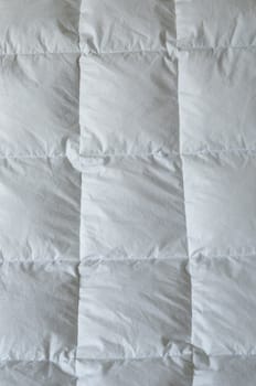 Detail of down comforter with white squares