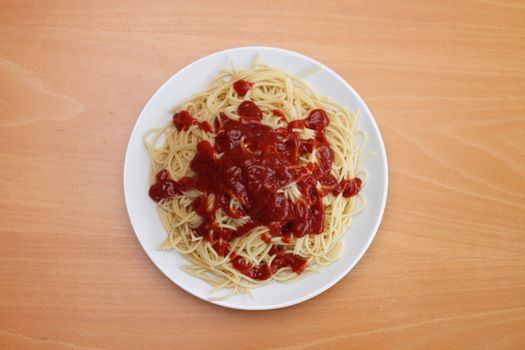 A boring plate of spaghetti with too much ketchup