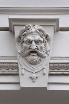 Mascarons. Architectural detail of the building