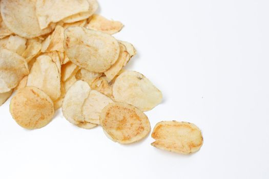 Salty potato chips isolated on white