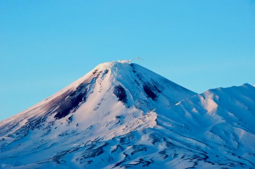 Volcano covered with snow in Russia on Kamchatka