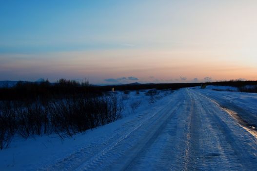 Winter road on a decline in Russia