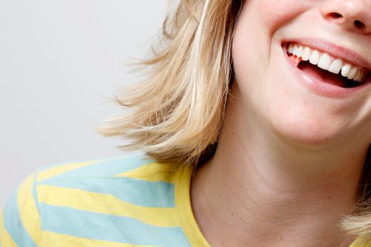 A girl playing with her chewing gum