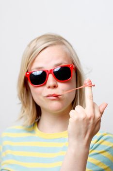 A girl playing with her chewing gum