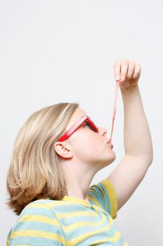 A girl playing with her chewing gum