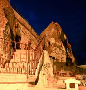 steps and hand rail of a cave house in Goreme, square format, night scene