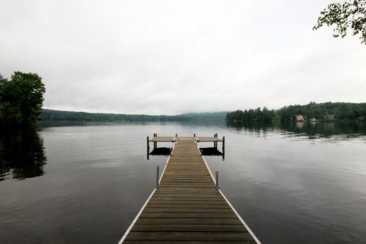 Lake side deck in early morning calm waters