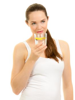 Isolated portrait of a young beautiful fresh woman drinking a glass of water with slice of lemon.