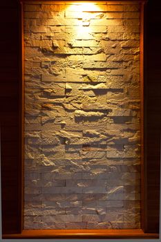 Stone walls are decorated with lights