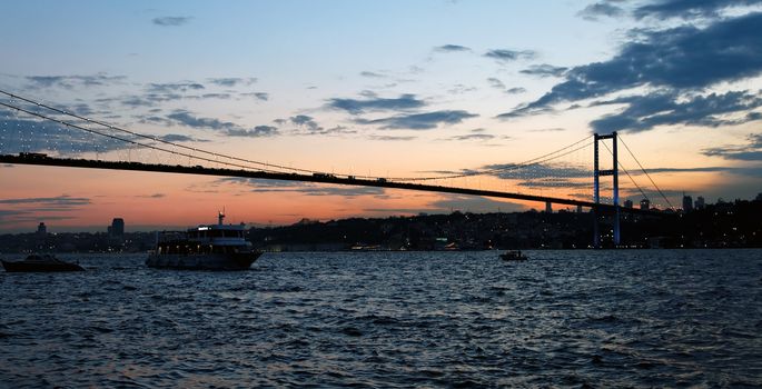 Life of cruising on the waterfront at Istanbul and Sunset, boats, launches and cruisers and backdrop of setting sun, landscape, copy space and crop area