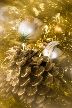white Christmas ball, golden cone and garland, shoot with soft filter