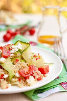 Refreshing and healthy quinoa salad with zucchini and tomatoes