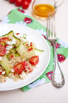 Refreshing and healthy quinoa salad with zucchini and tomatoes