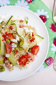 Healthy salad with quinoa, tomatoes and zucchini