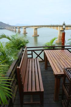 Dining table with view bridge and river