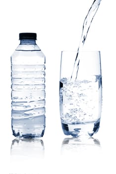 Mineral water in glass and bottle