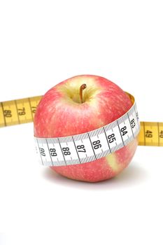 An apple measured with tape measure