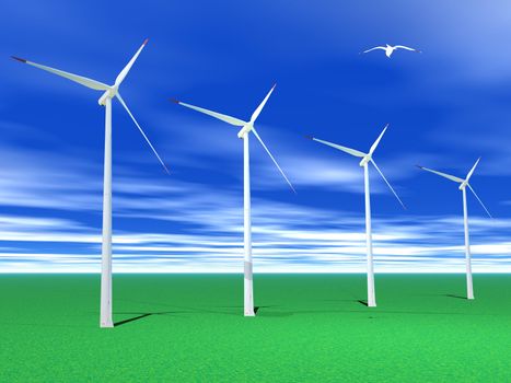 Bird flying over four white and red wind turbines in green grass by beautiful weather