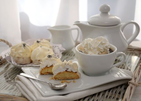 Cookies with zefirnoy filling in milk glaze with a cup of coffee and whipped cream