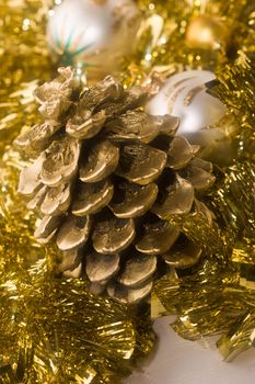 holiday series: white Christmas ball, golden cone and garland