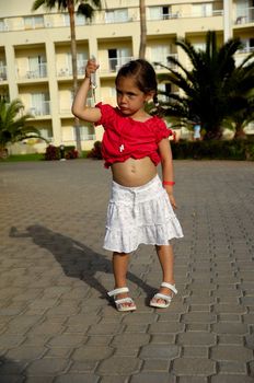 Young girl is holding a hotel key