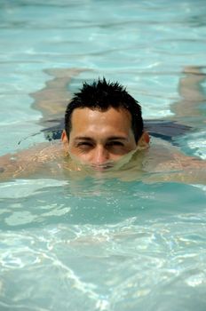 A man resting in a swimming pool