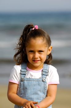 A sweet happy child on the beach.