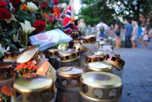 Roses, flags and candles at Oslo Cathedral commemorating the victims after the terrorist attacks 22.07.2011.