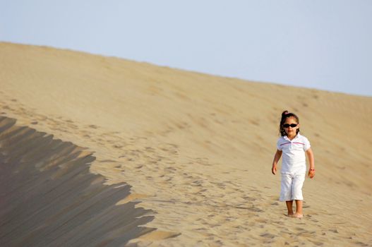 A child all alone in the desert