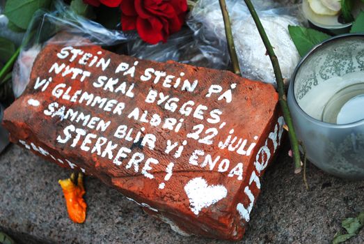 A brick with writings at Oslo Cathedral commemorating the victims after the terrorist attacks 22.07.2011.