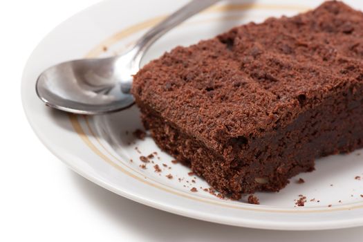 Chocolate dessert and a spoon on a plate